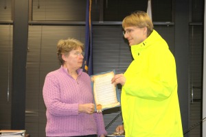 Mayor Cheryl Westover, left, presents Doug Osborne of the Sitka Bicycle Friendly Community Coalition with a proclamation from the City and Borough of Sitka backing Sitka's renewal application for a Bicycle Friendly Community award.